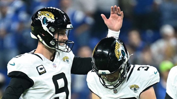 Dec 28, 2025; Indianapolis, Indiana, USA; Jacksonville Jaguars place kicker Cam Little (39) celebrates with punter Logan Cooke (9) after a field goal in the second half against the Indianapolis Colts at Lucas Oil Stadium. Mandatory Credit: Robert Goddin-Imagn Images
