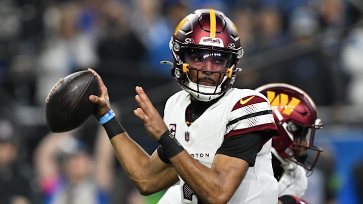 Washington Commanders quarterback Jayden Daniels throws a pass.