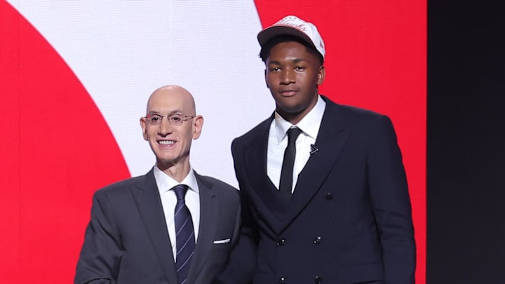 Jun 25, 2025; Brooklyn, NY, USA;  Derik Queen stands with NBA commissioner Adam Silver after being selected as the 13th pick by the Atlanta Hawks in the first round of the 2025 NBA Draft at Barclays Center. Mandatory Credit: Brad Penner-Imagn Images