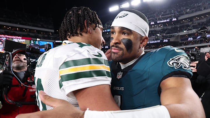 Green Bay Packers quarterback Jordan Love (10) and Philadelphia Eagles quarterback Jalen Hurts (1) embrace after last year's playoff game.