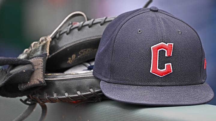 Jun 27, 2024; Kansas City, Missouri, USA; A general view a Cleveland Guardians hat and glove on the dugout railing before a game against the Kansas City Royals at Kauffman Stadium. Mandatory Credit: Peter Aiken-Imagn Images Jun 27, 2024; Kansas City, Missouri, USA; A general view a Cleveland Guardians hat and glove on the dugout railing before a game against the Kansas City Royals at Kauffman Stadium. Mandatory Credit: Peter Aiken-Imagn Images