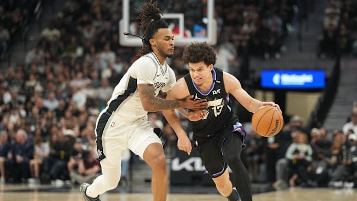 Dec 27, 2025; San Antonio, Texas, USA; Utah Jazz guard Walter Clayton Jr. (13) drives to the basket against San Antonio Spurs guard Stephon Castle (5) during the first half at Frost Bank Center. Mandatory Credit: Scott Wachter-Imagn Images 