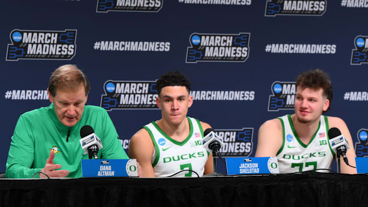 Mar 21, 2025; Seattle, WA, USA; Oregon Ducks head coach Dana Altman speaks at a press conference with guard Jackson Shelstad (3) and center Nate Bittle (32) after defeating the Liberty Flames in the first round of the NCAA Tournament at Climate Pledge Arena. Mandatory Credit: Steven Bisig-Imagn Images