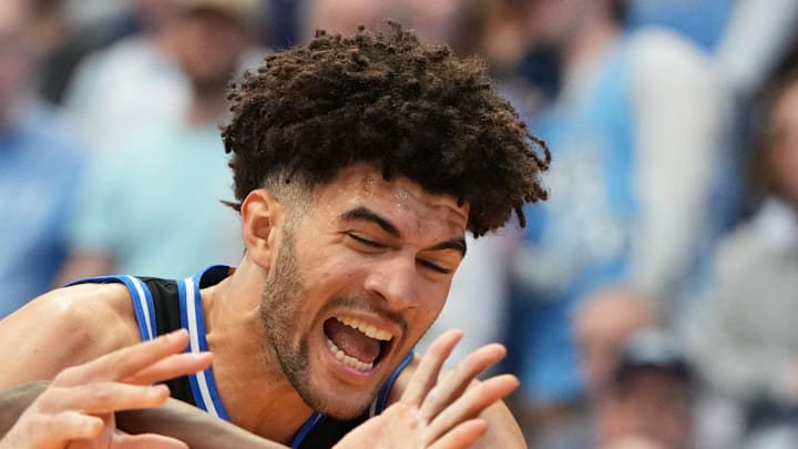Feb 7, 2026; Chapel Hill, North Carolina, USA;  North Carolina Tar Heels forward Caleb Wilson (8) and Duke Blue Devils forward Cameron Boozer (12) fight for the ball in the first  half at Dean E. Smith Center. Mandatory Credit: Bob Donnan-Imagn Images