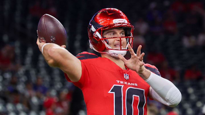 Nov 20, 2025; Houston, Texas, USA; Houston Texans quarterback C.J. Stroud (7) watches quarterback Davis Mills (10) warm up before playing against the Buffalo Bills at NRG Stadium. Mandatory Credit: Thomas Shea-Imagn Images