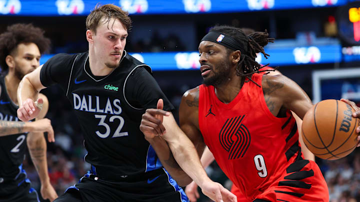 Nov 16, 2025; Dallas, Texas, USA; Portland Trail Blazers forward Jerami Grant (9) drives to the basket as Dallas Mavericks forward Cooper Flagg (32) defends during the second half at American Airlines Center. Mandatory Credit: Kevin Jairaj-Imagn Images Nov 16, 2025; Dallas, Texas, USA; Portland Trail Blazers forward Jerami Grant (9) drives to the basket as Dallas Mavericks forward Cooper Flagg (32) defends during the second half at American Airlines Center. Mandatory Credit: Kevin Jairaj-Imagn Images