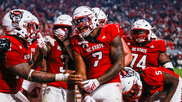 Nov 21, 2025; Raleigh, North Carolina, USA;  NC State Wolfpack tight end Justin Joly (7) celebrates his touchdown to win the game during the second half of the game against Florida State Seminoles at Carter-Finley Stadium. Mandatory Credit: Jaylynn Nash-Imagn Images