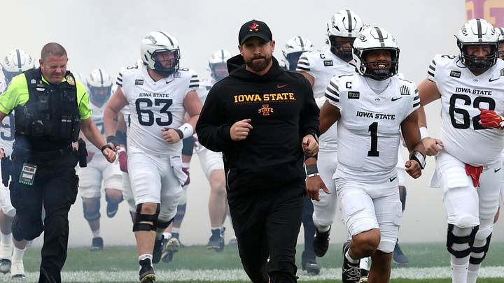Sep 26, 2026; Ames, Iowa, USA;  Iowa State Cyclones head coach Jimmy Rogers leads his team out against the Utah Utes at Jack Trice Stadium. 