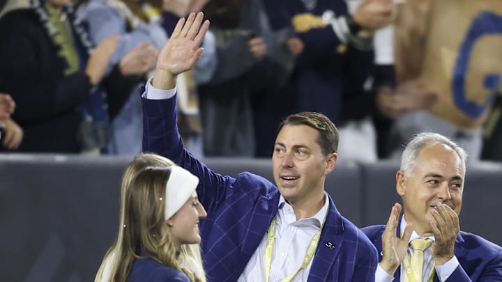 Oct 20, 2022; Atlanta, Georgia, USA; Georgia Tech Yellow Jackets athletic director J Batt is introduced on the field as president Angel Cabrera against the Virginia Cavaliers in the first half at Bobby Dodd Stadium. Mandatory Credit: Brett Davis-Imagn Images