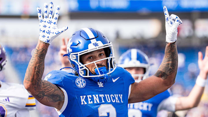 Kentucky Wildcats RB Seth McGowan celebrated after scoring as the Wildcats face off against the Tennessee Tech Golden Eagles.