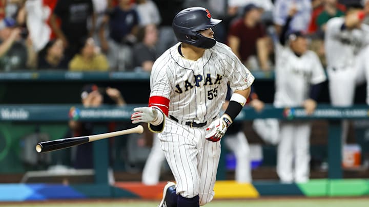 Mar 20, 2023; Miami, Florida, USA; Japan third baseman Munetaka Murakami (55) hits a walk-off double to win the game against Mexico during the ninth inning at LoanDepot Park. Mandatory Credit: Sam Navarro-Imagn Images