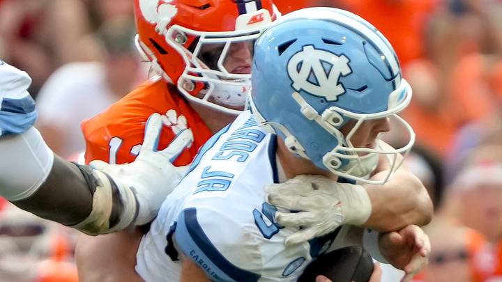 Clemson defensive end Will Heldt (13) sacks University of North Carolina quarterback Billy Edwards Jr. (9) during the third quarter at Memorial Stadium in Clemson, S.C. Saturday, September 19, 2026. Clemson defensive end Will Heldt (13) sacks University of North Carolina quarterback Billy Edwards Jr. (9) during the third quarter at Memorial Stadium in Clemson, S.C. Saturday, September 19, 2026.