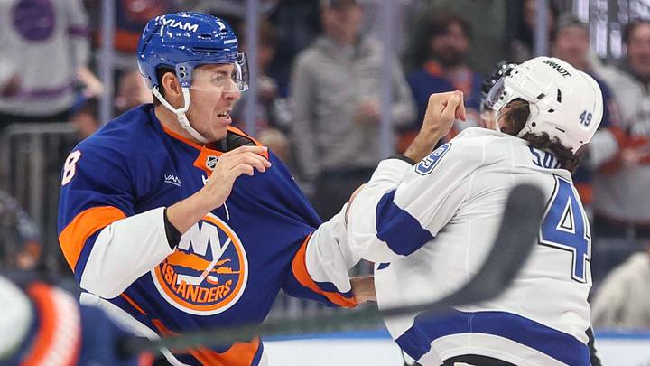 Oct 10, 2026; Elmont, New York, USA;  Tampa Bay Lightning right wing Scott Sabourin (49) fights with New York Islanders defenseman Logan Stanley (8) in the second period at UBS Arena.  Mandatory Credit: Wendell Cruz-Imagn Images