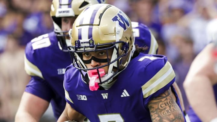 Sep 27, 2025; Seattle, Washington, USA; Washington Huskies wide receiver Raiden Vines-Bright (7) runs for yards after the catch against the Ohio State Buckeyes during the first quarter at Husky Stadium. Mandatory Credit: Joe Nicholson-Imagn Images