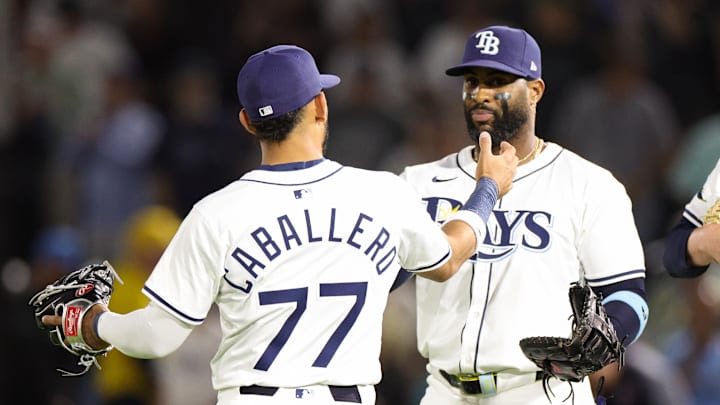 Tampa Bay Rays right fielder Jose Caballero (77) celebrates with first baseman Yandy Diaz (2) after a win over the Angels.