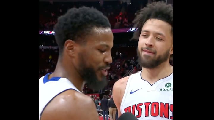 Malik Beasley and Cade Cunningham celebrate after a win.