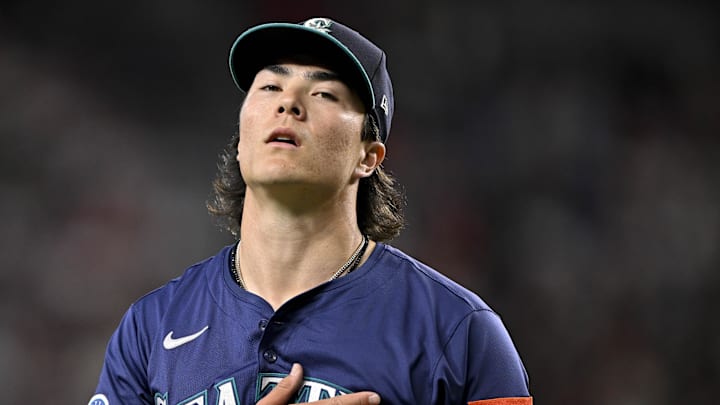 Seattle Mariners starting pitcher Bryan Woo (22) comes off the field after he pitches against the Texas Rangers during the first inning at Globe Life Field on June 28. Seattle Mariners starting pitcher Bryan Woo (22) comes off the field after he pitches against the Texas Rangers during the first inning at Globe Life Field on June 28.