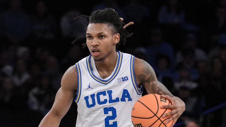 Dec 21, 2024; New York, NY, USA; UCLA Bruins guard Dylan Andrews (2) sets the play while being defended by North Carolina Tar Heels guard Elliot Cadeau (3) during the first half at Madison Square Garden. Mandatory Credit: John Jones-Imagn Images Dec 21, 2024; New York, NY, USA; UCLA Bruins guard Dylan Andrews (2) sets the play while being defended by North Carolina Tar Heels guard Elliot Cadeau (3) during the first half at Madison Square Garden. Mandatory Credit: John Jones-Imagn Images