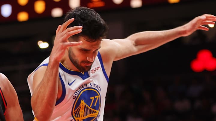 Mar 21, 2026; Atlanta, Georgia, USA; Atlanta Hawks center Jock Landale (31) grabs a rebound past Golden State Warriors center Omer Yurtseven (77) in the third quarter at State Farm Arena. Mandatory Credit: Brett Davis-Imagn Images