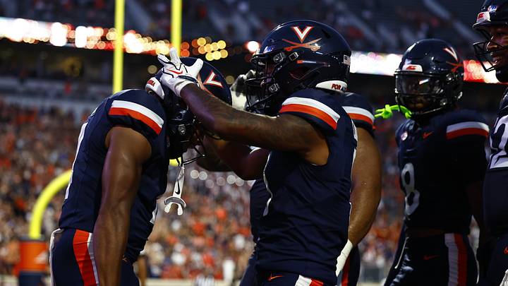 Virginia celebrates a touchdown. Virginia celebrates a touchdown.