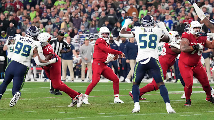 Jan 7, 2024; Glendale, Arizona, USA; Arizona Cardinals quarterback Kyler Murray (1) throws a touchdown pass against the Seattle Seahawks during the second half at State Farm Stadium. Mandatory Credit: Joe Camporeale-Imagn Images