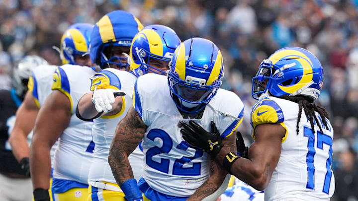 Nov 30, 2025; Charlotte, North Carolina, USA; Los Angeles Rams running back Blake Corum (22) celebrates after scoring a touchdown during the second quarter against the Carolina Panthers at Bank of America Stadium. Mandatory Credit: Jim Dedmon-Imagn Images