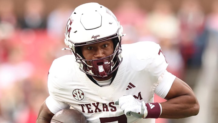 Oct 18, 2025; Fayetteville, Arkansas, USA; Texas A&M Aggies wide receiver KC Concepcion (7) runs after a catch during the first quarter against the Arkansas Razorbacks at Donald W. Reynolds Razorback Stadium. Mandatory Credit: Nelson Chenault-Imagn Images