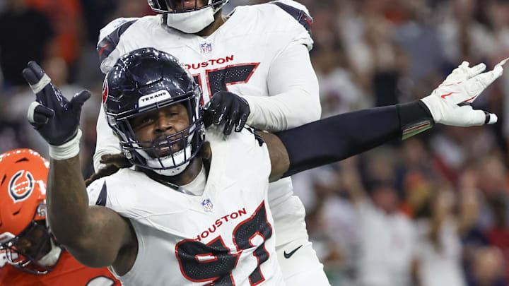 Sep 15, 2024; Houston, Texas, USA; Houston Texans defensive end Mario Edwards Jr. (97) reacts after sacking Chicago Bears quarterback Caleb Williams (18) (not pictured) in the second half at NRG Stadium. Mandatory Credit: Thomas Shea-Imagn Images