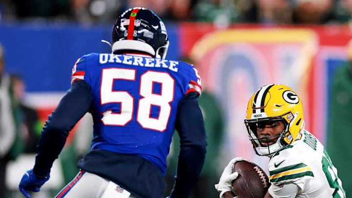 Green Bay Packers wide receiver Romeo Doubs (87) runs the ball against New York Giants linebacker Bobby Okereke. Green Bay Packers wide receiver Romeo Doubs (87) runs the ball against New York Giants linebacker Bobby Okereke.