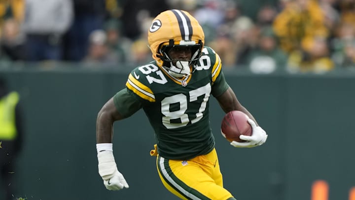 Nov 23, 2025; Green Bay, Wisconsin, USA; Green Bay Packers wide receiver Romeo Doubs (87) carries the ball Minnesota Vikings during the second half at Lambeau Field. Mandatory Credit: Kayla Wolf-Imagn Images