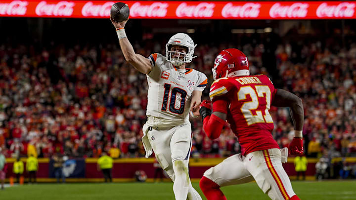 Dec 25, 2025; Kansas City, Missouri, USA; Denver Broncos quarterback Bo Nix (10) throws a touchdown pass during the fourth quarter at GEHA Field at Arrowhead Stadium. 