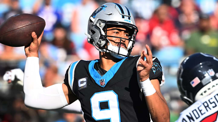 Oct 29, 2023; Charlotte, North Carolina, USA; Carolina Panthers quarterback Bryce Young (9) passes the ball as Houston Texans defensive end Will Anderson Jr. (51) pressures in the fourth quarter at Bank of America Stadium. Mandatory Credit: Bob Donnan-Imagn Images