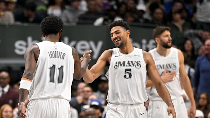 Nov 27, 2024; Dallas, Texas, USA; Dallas Mavericks guard Spencer Dinwiddie (26) and guard Kyrie Irving (11) and guard Quentin Grimes (5) during the game between the Dallas Mavericks and the New York Knicks at the American Airlines Center. Mandatory Credit: Jerome Miron-Imagn Images
