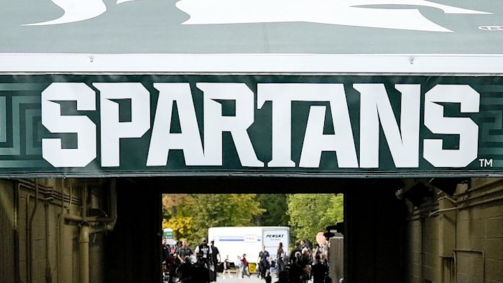 Sep 13, 2025; East Lansing, Michigan, USA; Michigan State offensive lineman Rakeem Johnson (55) throws a towel to fans after a victory over Youngstown State at Spartan Stadium. Mandatory Credit: Brendan Mullin-Imagn Images Sep 13, 2025; East Lansing, Michigan, USA; Michigan State offensive lineman Rakeem Johnson (55) throws a towel to fans after a victory over Youngstown State at Spartan Stadium. Mandatory Credit: Brendan Mullin-Imagn Images