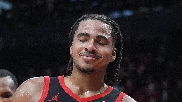 Apr 23, 2026; Toronto, Ontario, CAN; Toronto Raptors forward Collin Murray-Boyles (12) reacts after a collission with Cleveland Cavaliers guard Donovan Mitchell (45) during the second half of game three of the first round of the 2026 NBA Playoffs at Scotiabank Arena. Mandatory Credit: John E. Sokolowski-Imagn Images