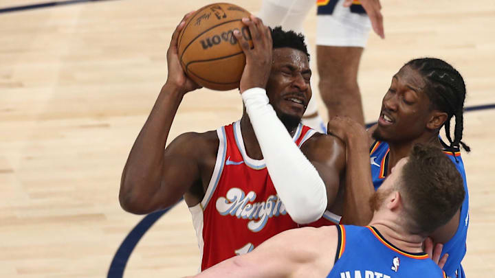 Apr 26, 2025; Memphis, Tennessee, USA; Memphis Grizzlies forward Jaren Jackson Jr. (13) drives to the basket as Oklahoma City Thunder center Isaiah Hartenstein (55) and forward Jalen Williams (8) defend during the second quarter during game four for the first round of the 2024 NBA Playoffs at FedExForum. Mandatory Credit: Petre Thomas-Imagn Images