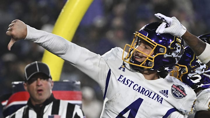 Dec 28, 2024; Annapolis, MD, USA; East Carolina Pirates quarterback Katin Houser (4) celebrators with teammates after scoring a touchdown during the second half of the Go Bowling Military Bowl against the North Carolina State Wolfpack at Navy-Marine Corps Memorial Stadium. Mandatory Credit: Tommy Gilligan-Imagn Images Dec 28, 2024; Annapolis, MD, USA; East Carolina Pirates quarterback Katin Houser (4) celebrators with teammates after scoring a touchdown during the second half of the Go Bowling Military Bowl against the North Carolina State Wolfpack at Navy-Marine Corps Memorial Stadium. Mandatory Credit: Tommy Gilligan-Imagn Images