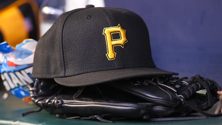 Sep 8, 2023; Atlanta, Georgia, USA; A detailed view of a Pittsburgh Pirates hat and glove before a game against the Pittsburgh Pirates in the first inning at Truist Park.