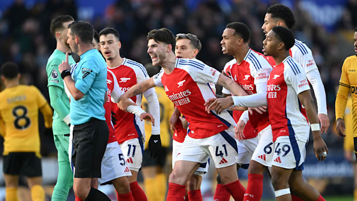 Arsenal players surrounded referee Michael Oliver
