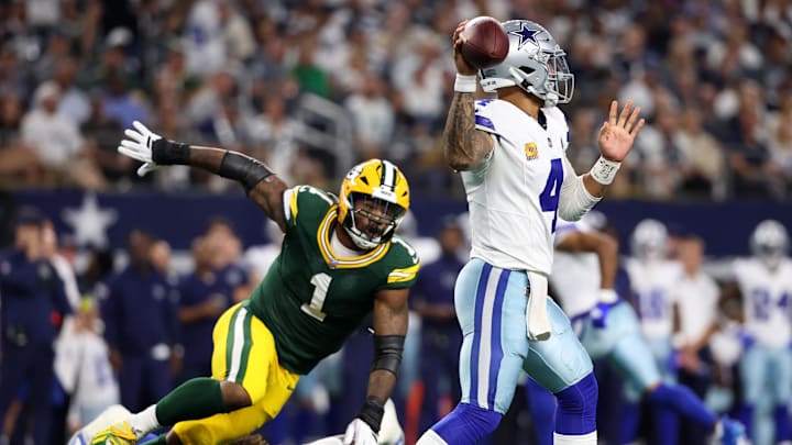 Dallas Cowboys quarterback Dak Prescott throws under pressure from Green Bay Packers defensive end Micah Parsons