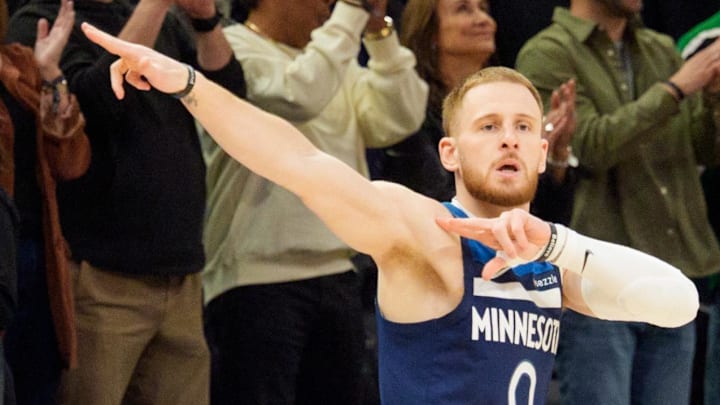 Apr 5, 2026; Minneapolis, Minnesota, USA; Minnesota Timberwolves guard Donte DiVincenzo (0) celebrates a three pointer against the Charlotte Hornets in the first quarter at Target Center. Mandatory Credit: Matt Blewett-Imagn Images