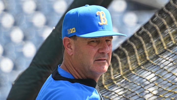 Jun 14, 2025; Omaha, Neb, USA;  UCLA Bruins head coach John Savage watches the team warm up before the game against the Murray State Races at Charles Schwab Field. Mandatory Credit: Steven Branscombe-Imagn Images