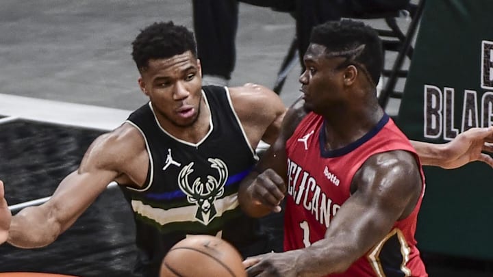 Feb 25, 2021; Milwaukee, Wisconsin, USA; Milwaukee Bucks forward Giannis Antetokounmpo (34) pressures New Orleans Pelicans forward Zion Williamson (1) in the third quarter at Fiserv Forum. Mandatory Credit: Benny Sieu-Imagn Images