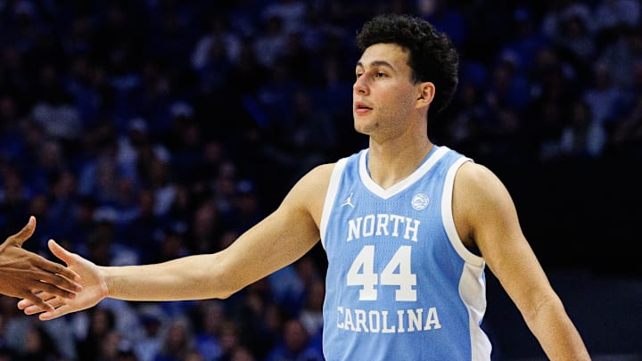 Dec 2, 2025; Lexington, Kentucky, USA; North Carolina Tar Heels guard Luka Bogavac (44) fives forward Jarin Stevenson (15) during the first half against the Kentucky Wildcats at Rupp Arena at Central Bank Center. Mandatory Credit: Jordan Prather-Imagn Images Dec 2, 2025; Lexington, Kentucky, USA; North Carolina Tar Heels guard Luka Bogavac (44) fives forward Jarin Stevenson (15) during the first half against the Kentucky Wildcats at Rupp Arena at Central Bank Center. Mandatory Credit: Jordan Prather-Imagn Images
