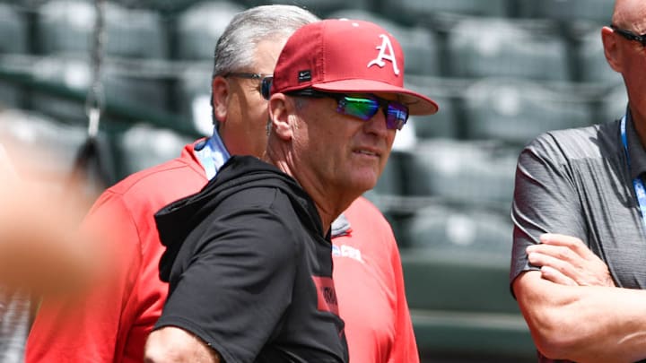 Arkansas Razorbacks coach Dave Van Horn visiting with national media at practice for the Super Regional against the Tennessee Volunteers at Baum-Walker Stadium in Fayetteville, Ark.