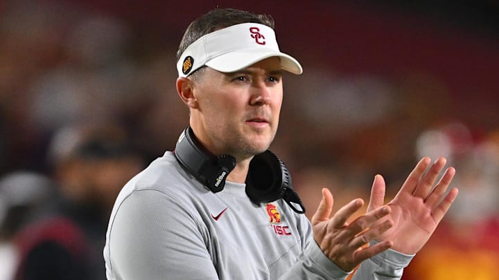 Oct 1, 2022; Los Angeles, California, USA;  USC Trojans head coach Lincoln Riley applauds after a touchdown in the first half against the Arizona State Sun Devils at United Airlines Field at the Los Angeles Memorial Coliseum. Mandatory Credit: Jayne Kamin-Oncea-Imagn Images
