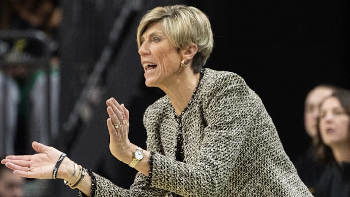 Iowa coach Jan Jensen cheers on her team against Oregon at Matthew Knight Arena Sunday, Jan. 19, 2025.