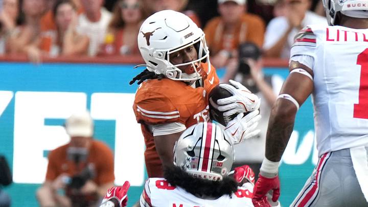 Sep 12, 2026; Austin, Texas, USA;  Texas Longhorns running back Hollywood Smothers (2) runs against Ohio State Buckeyes safety Jaylen McClain (8) at Darrell K Royal-Texas Memorial Stadium.  Mandatory Credit: Scott Wachter-Imagn Images