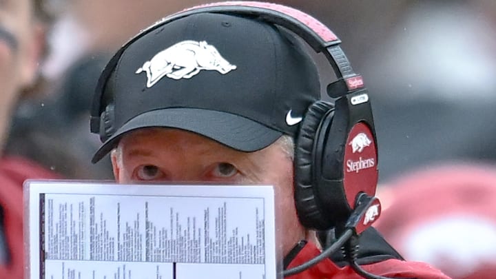 Bobby Petrino looks over his notes during Arkansas' loss to the Auburn Tigers at Razorback Stadium in Fayetteville. He hopes to avoid the spotlight in his next job.