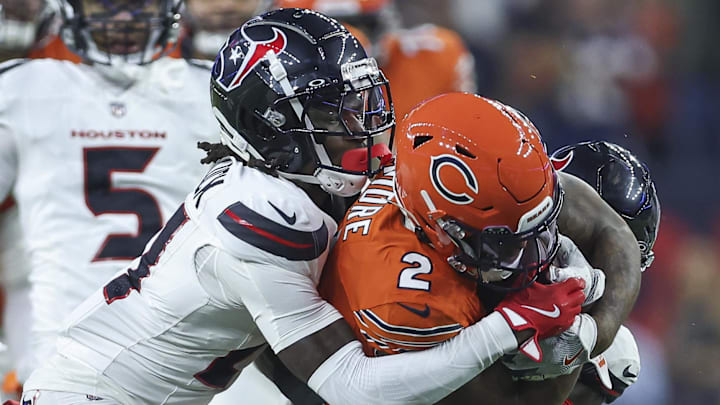 Sep 15, 2024; Houston, Texas, USA; Houston Texans safety Calen Bullock (21) attempts to tackle Chicago Bears wide receiver DJ Moore (2) during the game at NRG Stadium. Mandatory Credit: Troy Taormina-Imagn Images
